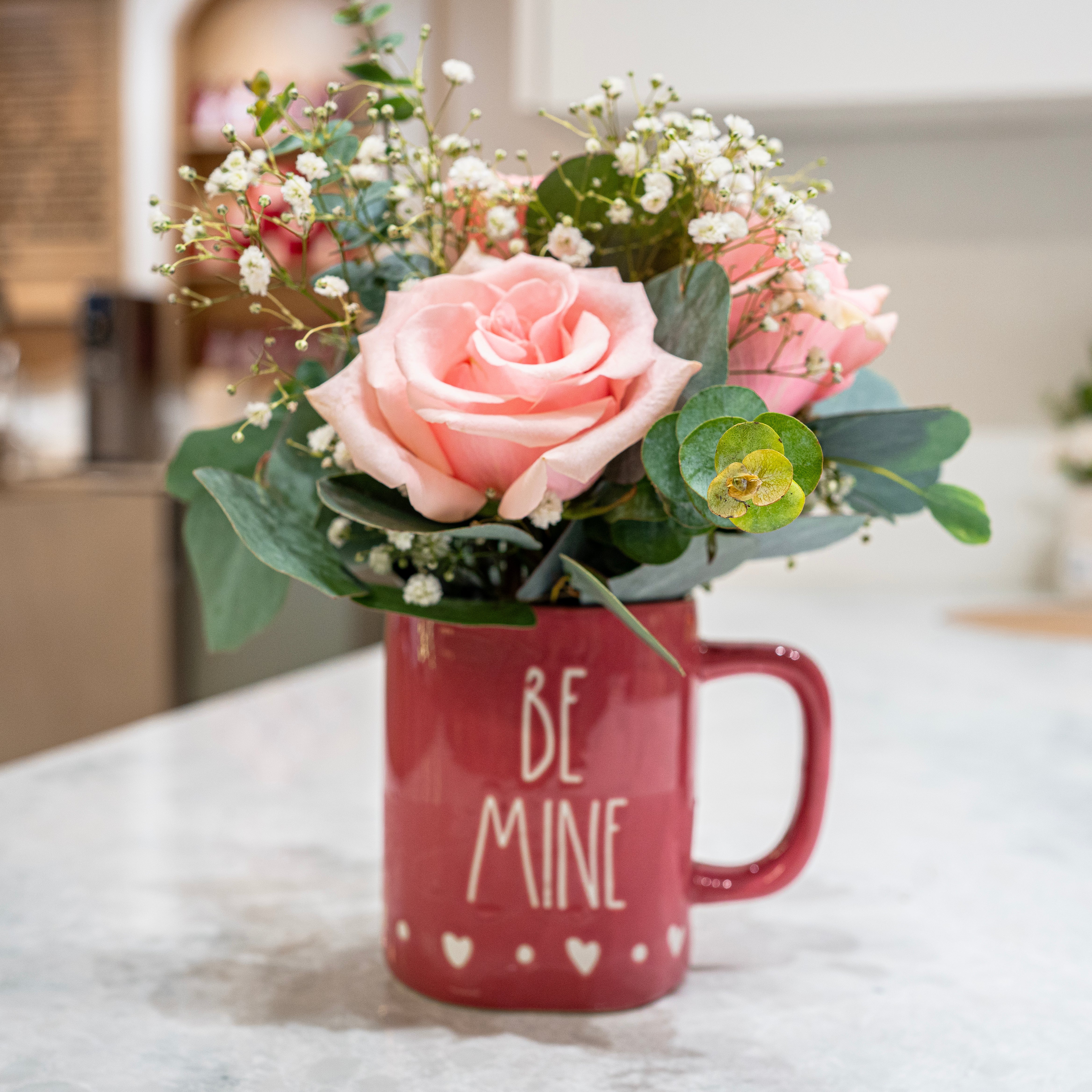 Sweet on Robson is a blush rose mug arrangement from our Valentine’s collection, featuring eucalyptus and baby’s breath. Designed in Vancouver by Bouquet Café.