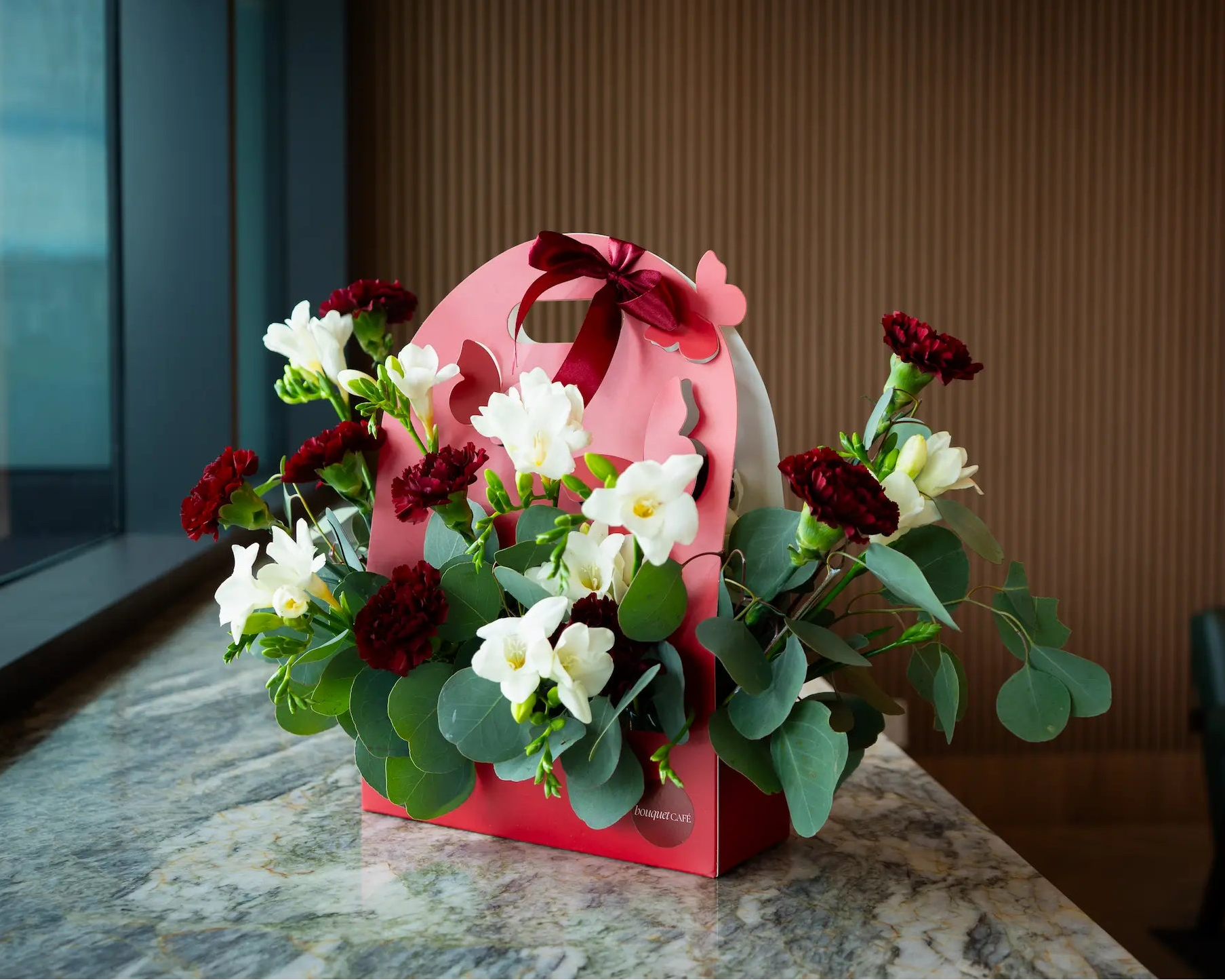 Signature floral arrangements by Bouquet Café, Vancouver’s flower shop and coffee bar. A limited-edition design combining seasonal blooms and artisanal presentation.