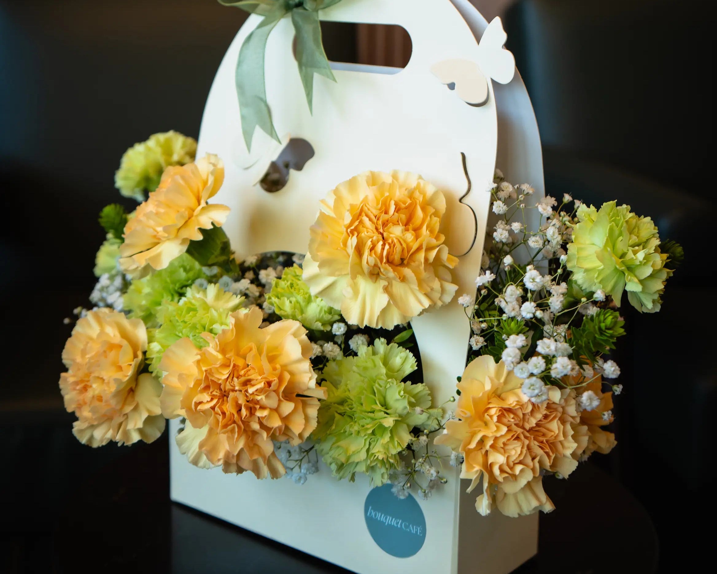 Signature floral arrangement by Bouquet Café, Vancouver’s flower shop and coffee bar. A limited-edition design combining seasonal blooms and artisanal presentation.